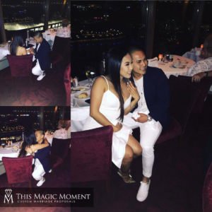 Couple posing for pictures after getting engaged in nightclub