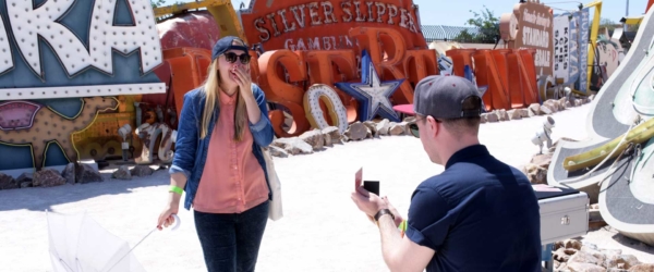 Vegas Wedding Proposal with couple getting engaged at Neon Museum