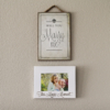 Proposal decorations on wall with "Marry Me?" sign and couples photo