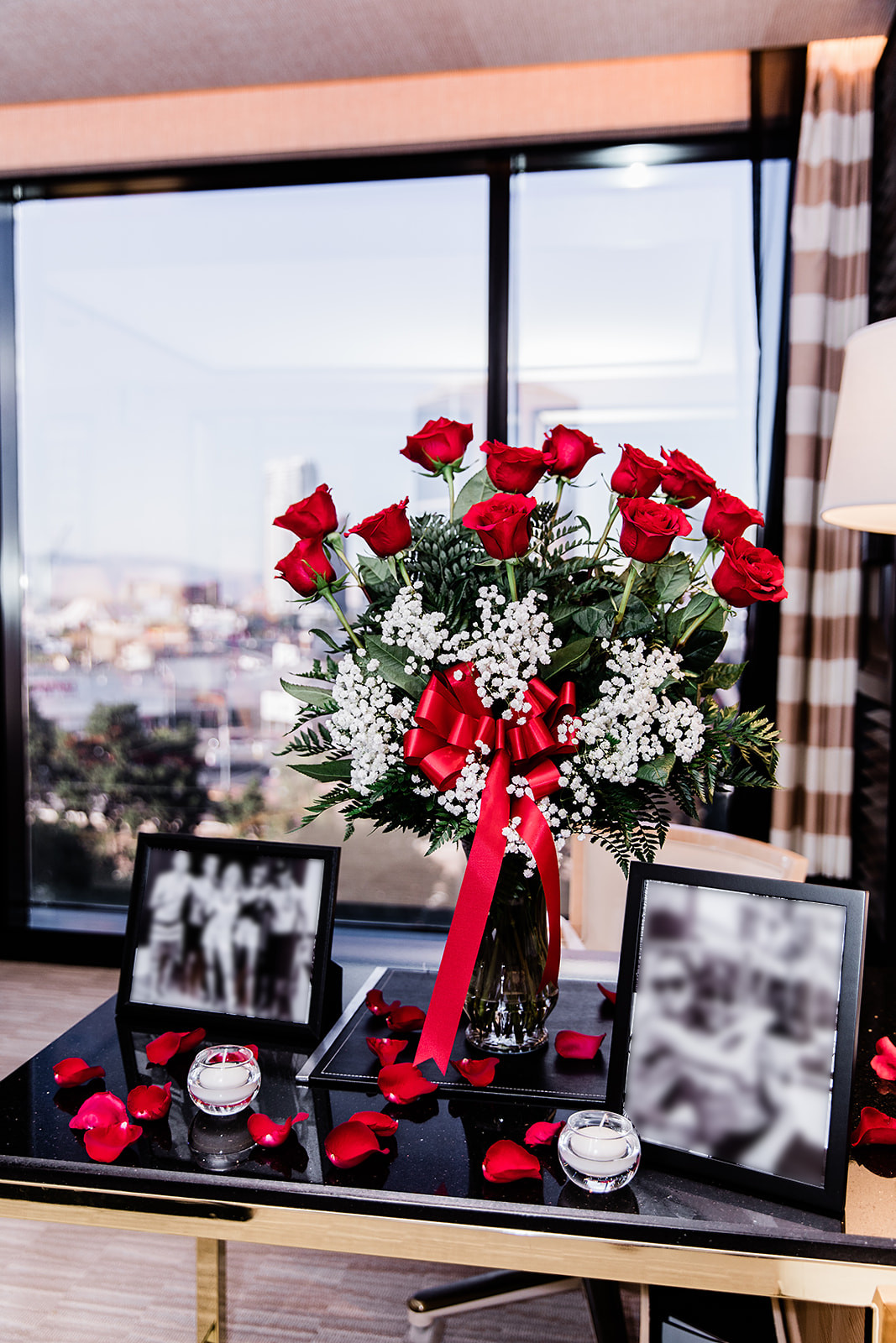 Romantic wedding proposal inside of Vegas hotel room with large rose bouquet