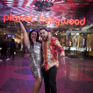 Couple posing for Surprise Photographer Proposal Tour in Las Vegas near Planet Hollywood casino