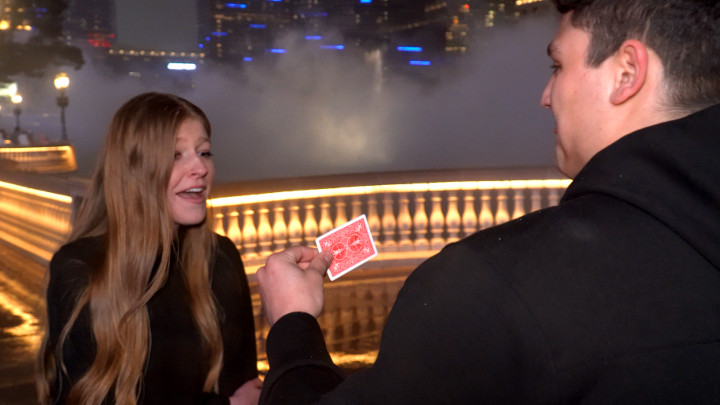 Couple gets engaged during a magic marriage proposal in Las Vegas in front of Bellagio fountains
