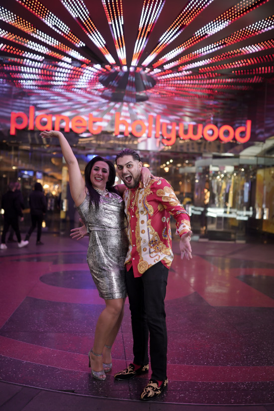 Man and woman pose on Las Vegas strip during proposal photo tour