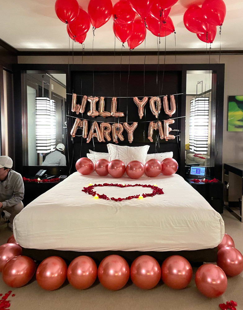 Las Vegas hotel room decorated with balloons, roses and romantic decorations for a marriage proposal