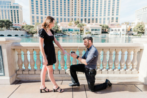 A man drops to one knee for a marriage proposal in front of the Bellagio Fountains in Las Vegas.