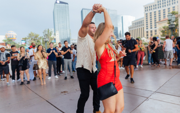 A couple dances after a flash mob marriage proposal in Las Vegas during the day.